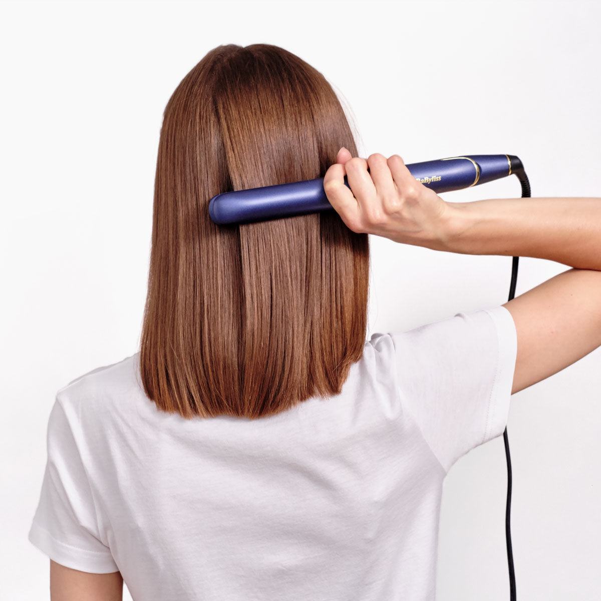 Midnight Luxe 235 Hair Straightener in use on model